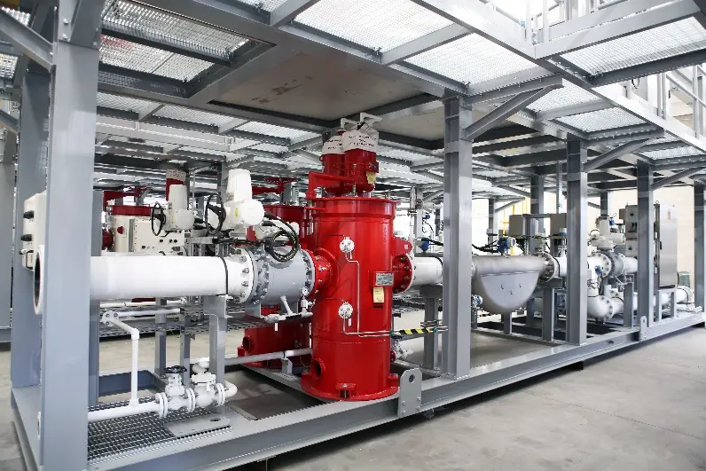 Flow metering skid with air elimination equipment