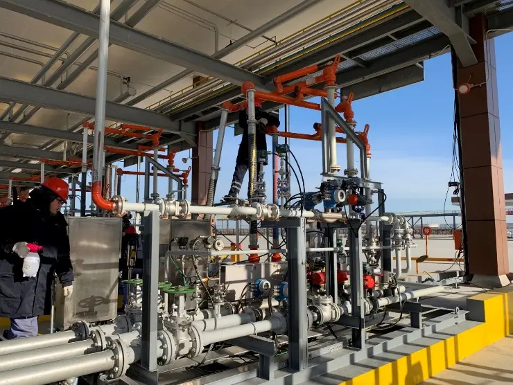 Modular truck loading skid installed beneath a terminal canopy